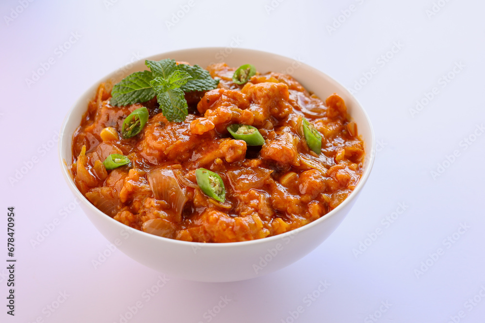 Gobi Manchurian curry gravy, Gobi 65, chilly gobi or cauliflower fry. Popular street food of India made of cauliflower florets Mumbai India.