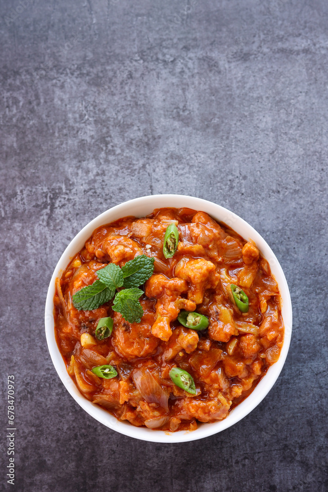Gobi Manchurian curry gravy, Gobi 65, chilly gobi or cauliflower fry. Popular street food of India made of cauliflower florets Mumbai India. Gobi Manchurian curry gravy, Gobi 65, chilly gobi or cauliflower fry. Popular street food of India made of cauliflower florets Mumbai India.