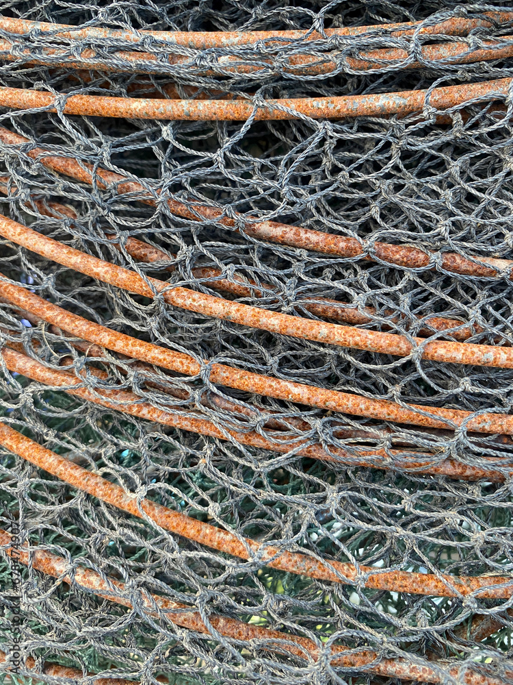 old rusty metal rod with fishing net old rusty metal rod with fishing net