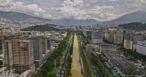 Medellin Colombia Aerial v13 flyover above river capturing heavy traffics and cityscape across Guayabal, Villa Carlota, Santa Fe and Alpujarra neighborhoods - Shot with Mavic 3 Cine - November 2022 photo