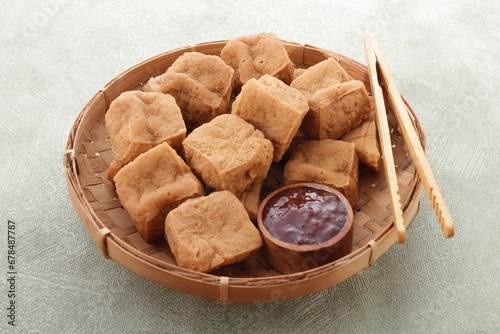 Tahu sumedang is a Sundanese deep-fried tofu from Sumedang, West Java, Indonesia. It was first made by a Chinese Indonesian named Ong Kino. It has some different characteristics from other tofu. photo