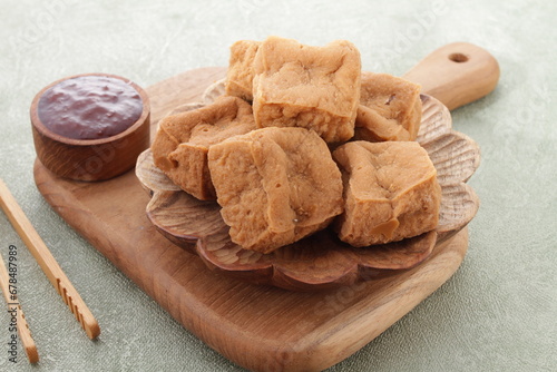 Tahu sumedang is a Sundanese deep-fried tofu from Sumedang, West Java, Indonesia. It was first made by a Chinese Indonesian named Ong Kino. It has some different characteristics from other tofu. photo