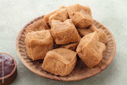 Tahu sumedang is a Sundanese deep-fried tofu from Sumedang, West Java, Indonesia. It was first made by a Chinese Indonesian named Ong Kino. It has some different characteristics from other tofu. photo