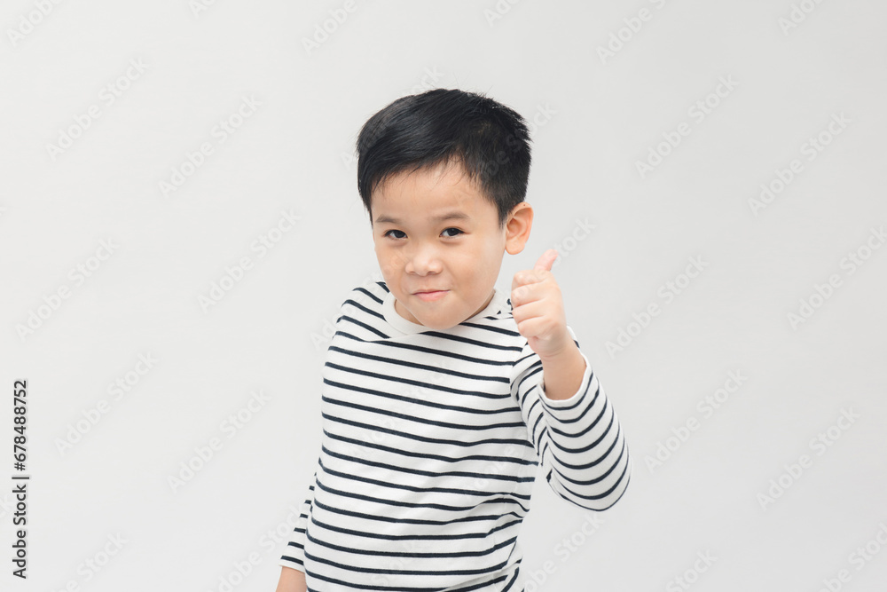 Banner of Happy asian boy shows thumbs up gesture on white background Banner of Happy asian boy shows thumbs up gesture on white background