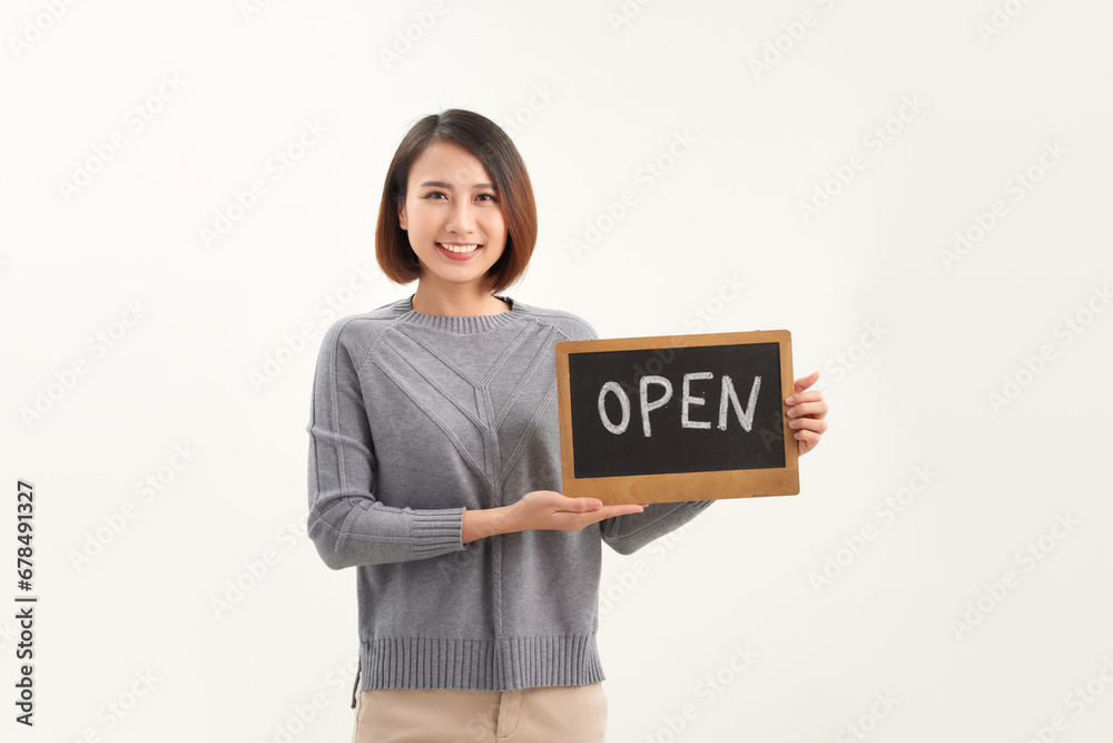 Female florist holding OPEN sign on white background Female florist holding OPEN sign on white background