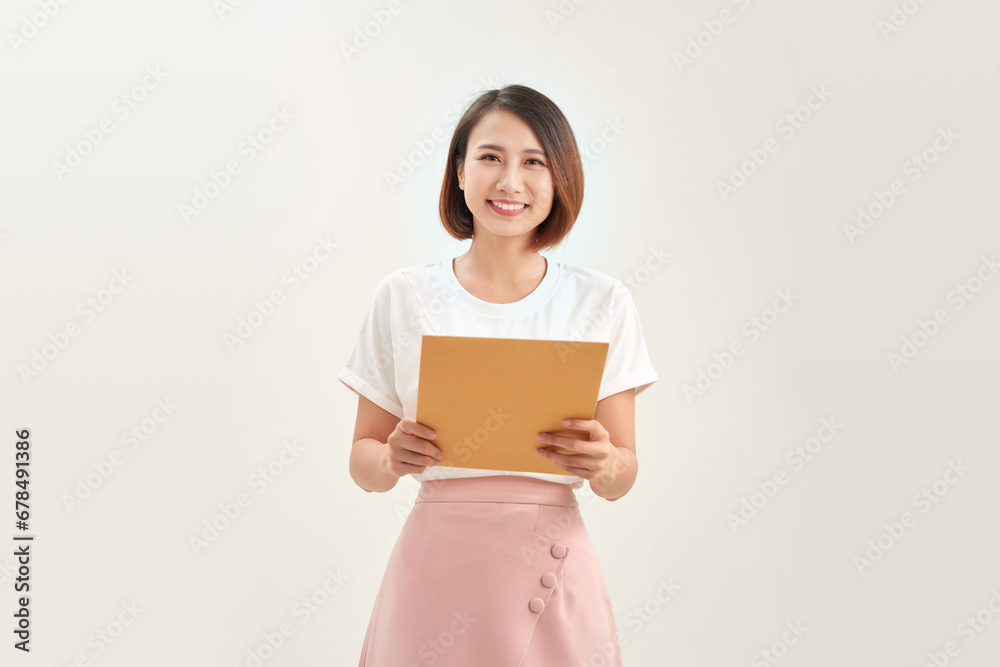 business woman holding brown paper envelopes in office business woman holding brown paper envelopes in office