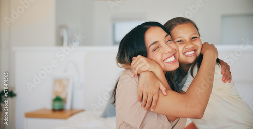 Face, smile and a mother hugging her daughter in the bedroom of their home in the morning together. Family, love and a happy young girl embracing her single parent while on a bed in their apartment photo