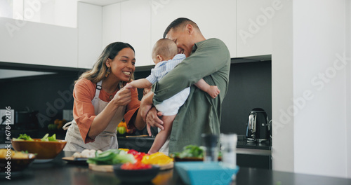 Family  smile and play or cooking  love and bonding or fun  relax and support or laughing at home. Happy parents and baby  connect and humor or funny  joy and relaxed or silly  goofy and kitchen