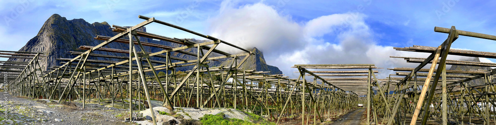 panorama of wooden fish dryer on a fishing village Reine in Lofoten Islands, North Norway. panorama of wooden fish dryer on a fishing village Reine in Lofoten Islands, North Norway.