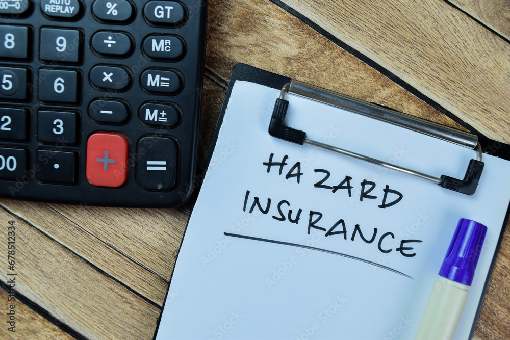 Concept of Hazard Insurance write on paperwork isolated on Wooden Table.