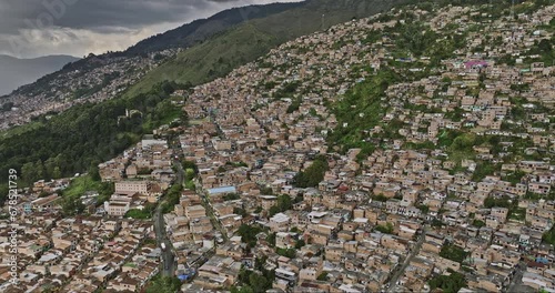 Medellin Colombia Aerial v44 drone flyover Los Mangos and Llanaditas capturing residential hillside Comuna 8 and Villa Hermosa, houses on the steep slopes - Shot with Mavic 3 Cine - November 2022 photo