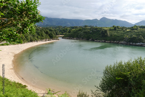 poo beach, coast with lush vegetation, Asturias, Spain