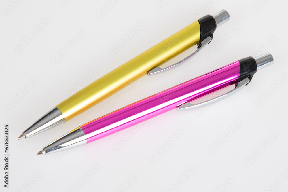 pen ballpoint pink and yellow pair of pencil on white background pen ballpoint pink and yellow pair of pencil on white background