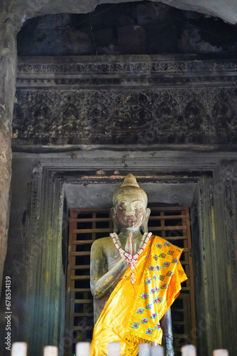 Buddha being worshipped inside the sanctum of Angkor Wat temple at Siem Reap, Cambodia, Asia