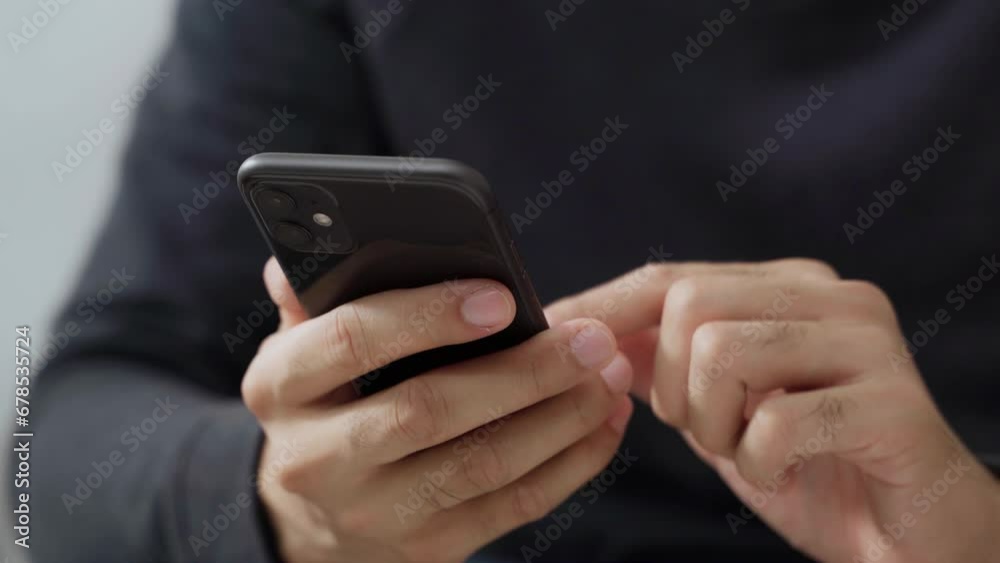 The man is using a smartphone for communication, internet, social networking, and online shopping. Technology concept. The man is using a smartphone for communication, internet, social networking, and online shopping. Technology concept.