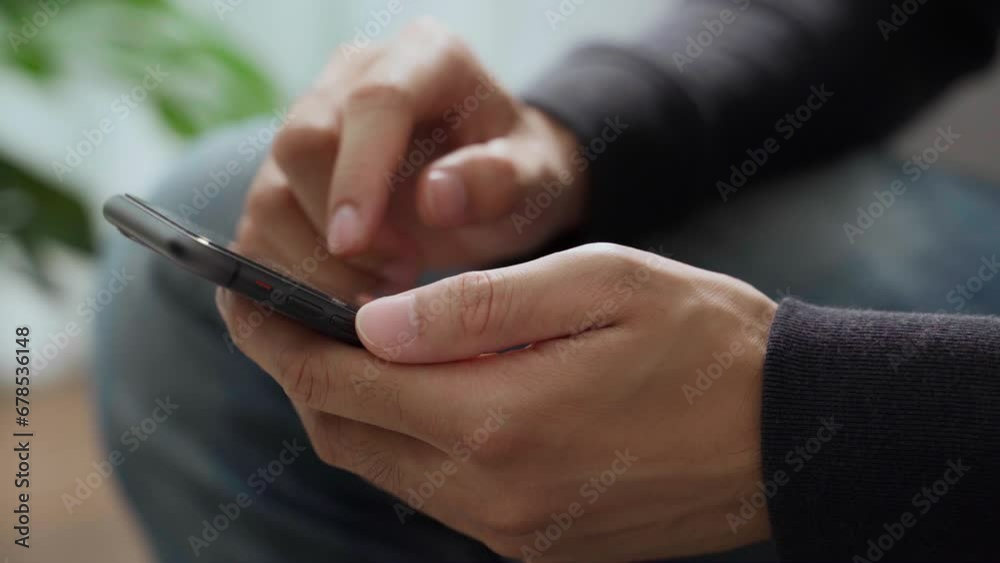 The man is using a smartphone for communication, internet, social networking, and online shopping. Technology concept. The man is using a smartphone for communication, internet, social networking, and online shopping. Technology concept.