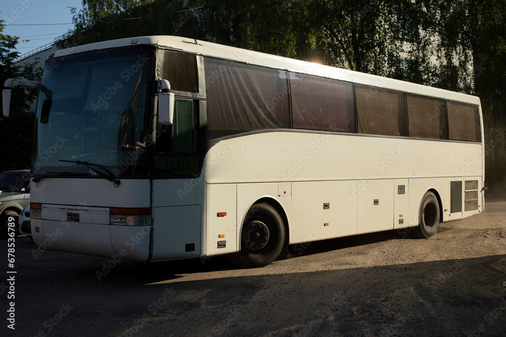 Bus in parking lot. Regular bus on street. Transport on road.