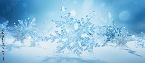 Real snowflakes on snow featured on a winter themed card © Vusal