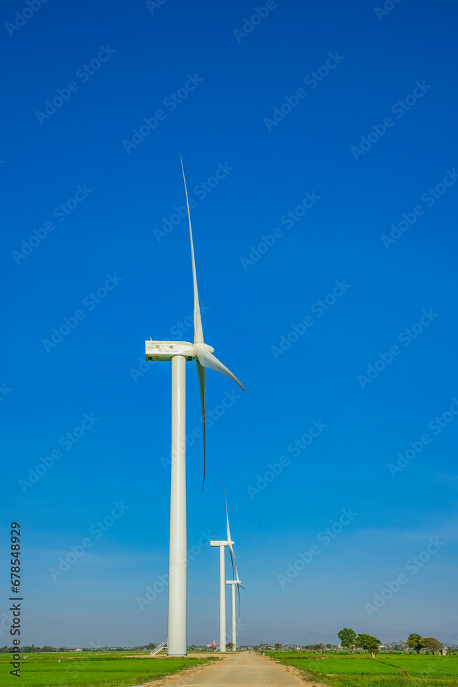 Wind power plant. green meadow with Wind turbines generating electricity, Ninh Thuan, Vietnam Wind power plant. green meadow with Wind turbines generating electricity, Ninh Thuan, Vietnam