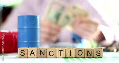 Embargo and sanctions on Russian oil supplies. Businessman counts dollars oil and gas inflation photo
