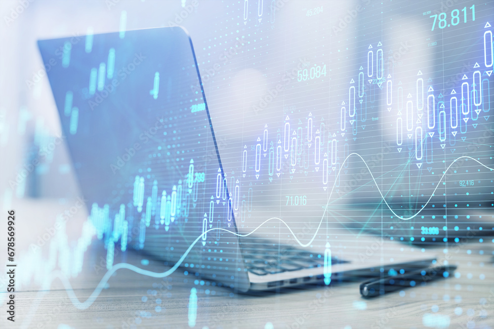Close up of laptop computer on desk with glowing candlestick forex chart on blurry background. Stock market, trading analysis and investment concept. Toned image. Double exposure. Close up of laptop computer on desk with glowing candlestick forex chart on blurry background. Stock market, trading analysis and investment concept. Toned image. Double exposure.
