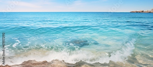 Stunning Mediterranean waters gently touching the beach