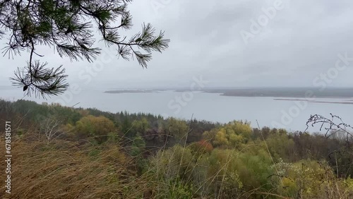Autumn panorama of the Dnipro River from the cliffs in rainy weather. The wide Dnieper roars and moans. Cloudy sky in Ukraine. Kaniv mountains, Trakhtemyriv, Vytachy mountains. High quality 4k footage photo
