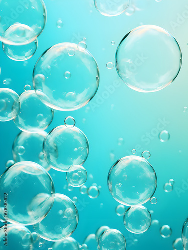 Transparent abstract soap bubbles on turquoise background 