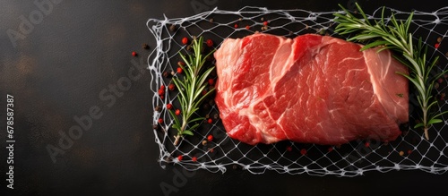Meatloaf made with pork roasted in a net for a delicious and nutritious raw meat dish photo
