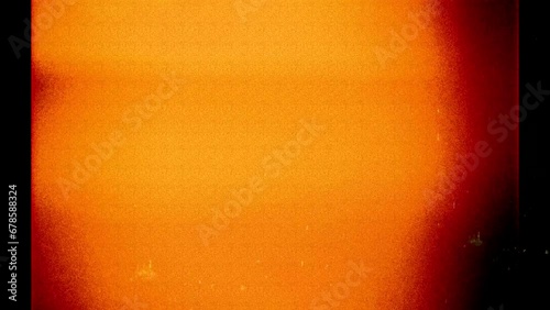 Photo filmstrip frame orange light leak and noise flickering background, backdrop, graphical resource in 4k, 35mm negative look	 photo