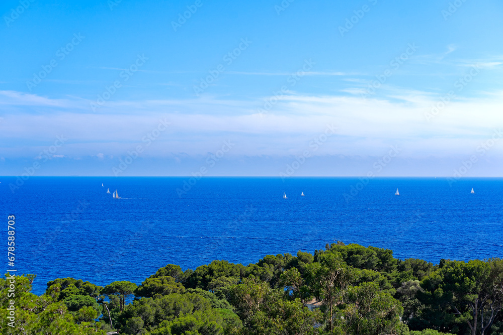 Aerial view from Giens Peninsula with Mediterranean Sea and sailing boats in the background on a sunny late spring day. Photo taken June 10th, 2023, Giens, Hyères, France.