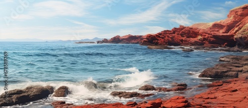 Ocean plus rocks that are red
