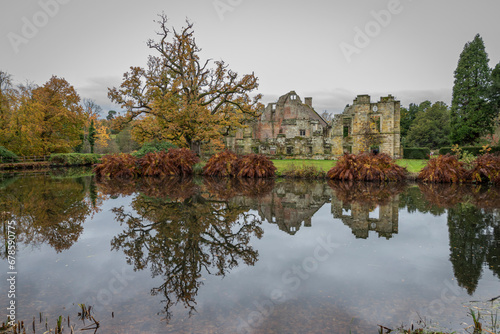 Autumnal colours and the large Oak tree at Scotney Castle in the UK