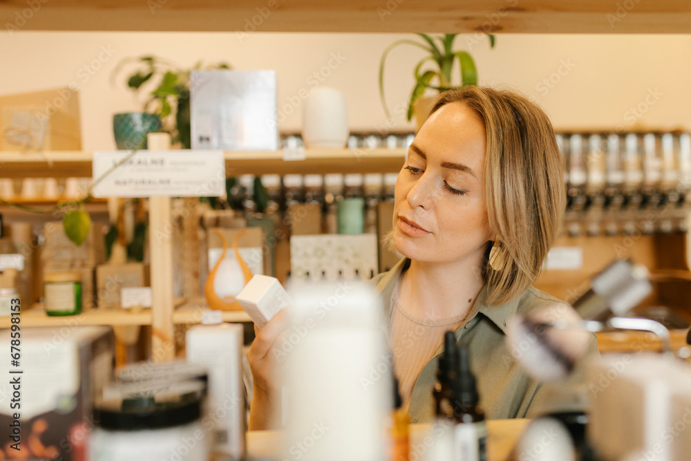 Blond woman choosing beauty products in store Blond woman choosing beauty products in store