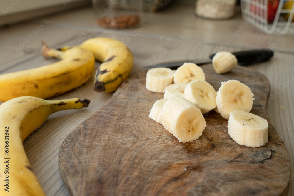 Sliced banana on the table at the kitchen Sliced banana on the table at the kitchen