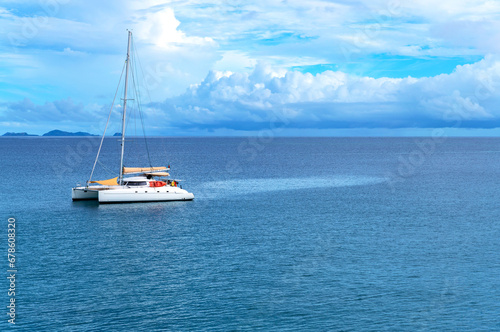 Sailing boat in calm blue sea