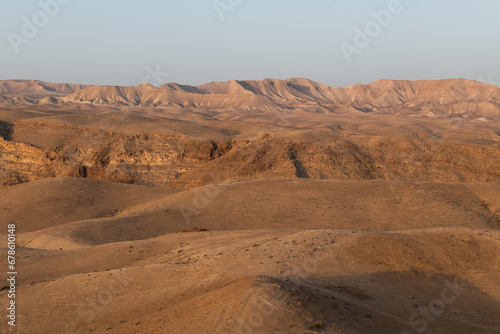 Early morning light on the brown and barren Judean Desert in Israel