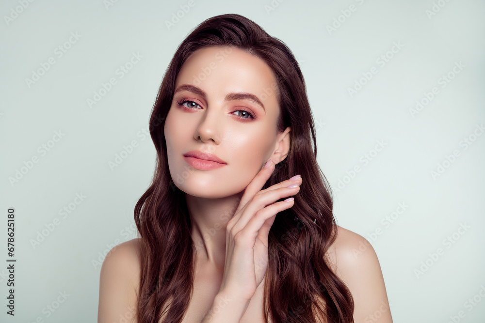 Photo portrait of attractive young woman touch soft silky cheek spa salon isolated on light gray color background Photo portrait of attractive young woman touch soft silky cheek spa salon isolated on light gray color background
