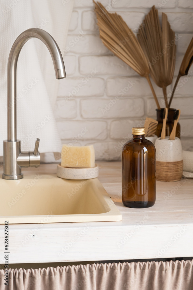 Recycled plastic pump bottle for mockup on white brick wall background near sink Recycled plastic pump bottle for mockup on white brick wall background near sink