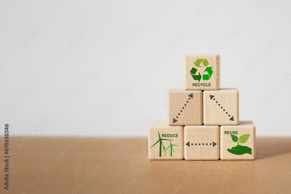 stack of wooden cube block , reduce, reuse and recycle text and green ...