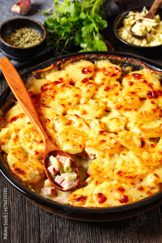 au gratin potatoes with diced ham and green peas
