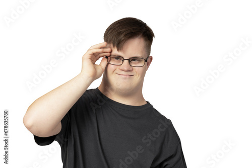 PNG, a boy with down syndrome in a black t-shirt posing for the camera, isolated on a white background © Atlas