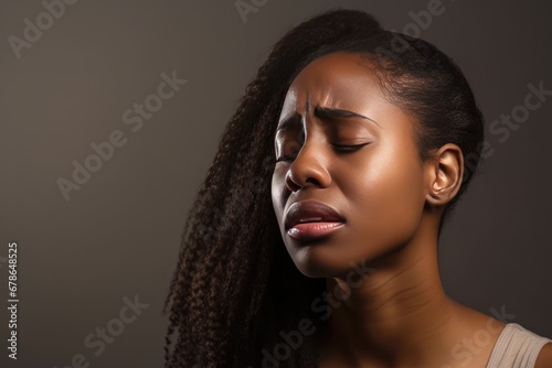African Woman Experiencing Stomach Pain On Plain Background