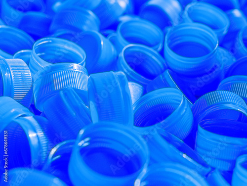 Top view Blue plastic bottle caps.Recycling collection and production processing plastic bottle caps background