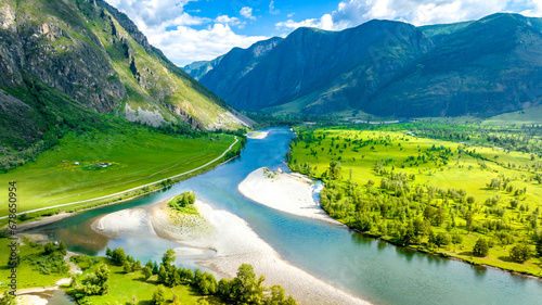 Summer landscape in the Chulyshman mountain valley. Winding mountain river, green alpine meadows and beautiful mountains. Russian nature. Gorny Altai, Siberia photo