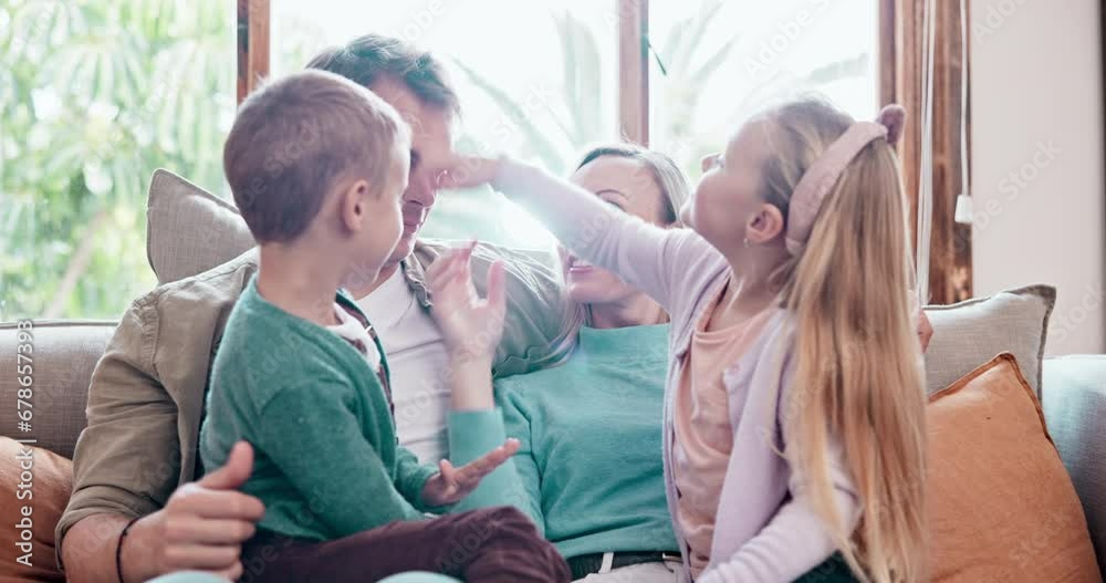 Happy, talking and children with parents on a sofa in the living room of modern family home. Smile, bonding and young kids relaxing and speaking with mother and father in the lounge together at house Happy, talking and children with parents on a sofa in the living room of modern family home. Smile, bonding and young kids relaxing and speaking with mother and father in the lounge together at house