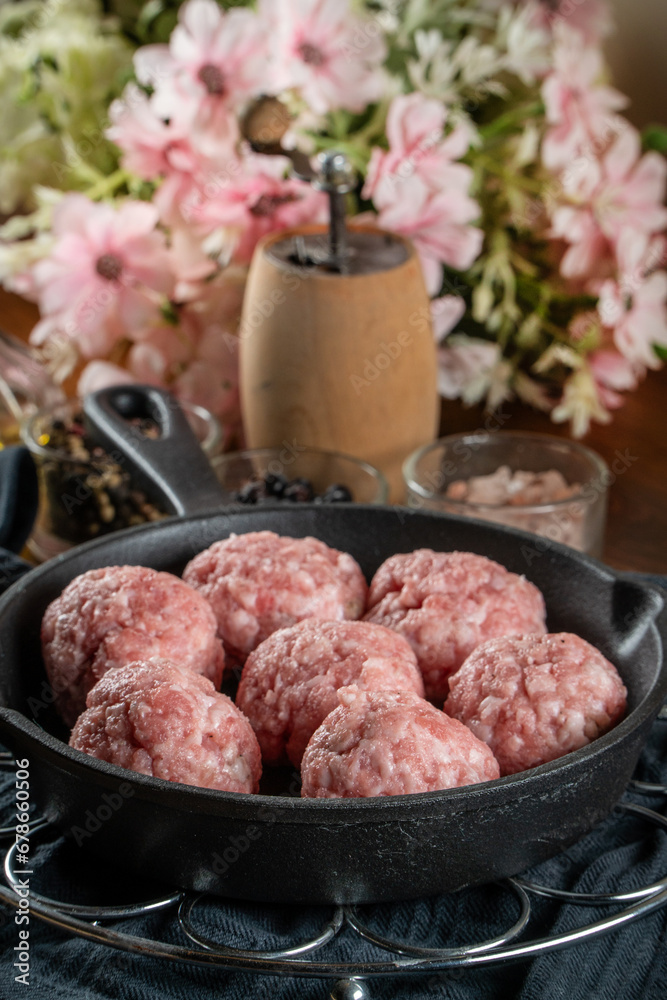 Fresh raw pork meatballs with spices Fresh raw pork meatballs with spices