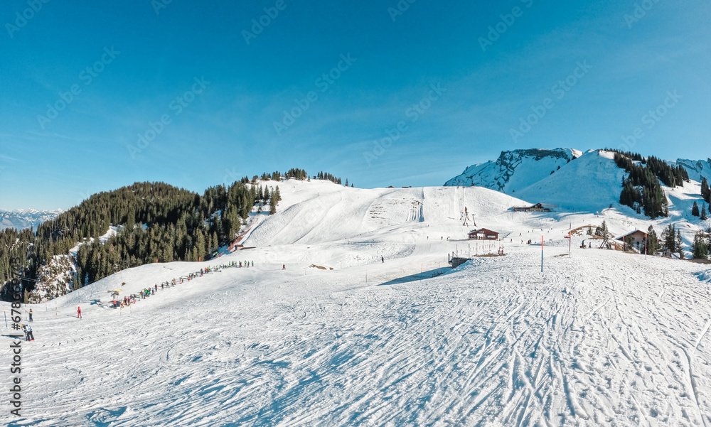 Ski resort view during winter time - Holidays, snow gear renting, skiing, snowboarding and mountain landscape concept