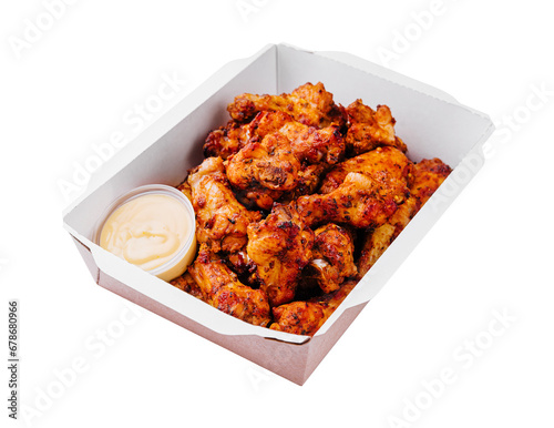 Fried chicken wings and legs in a paper box