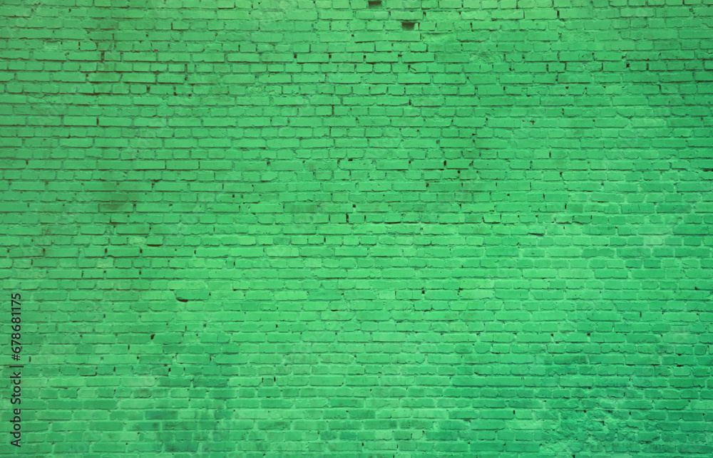 The texture of the brick wall of many rows of bricks painted in green color